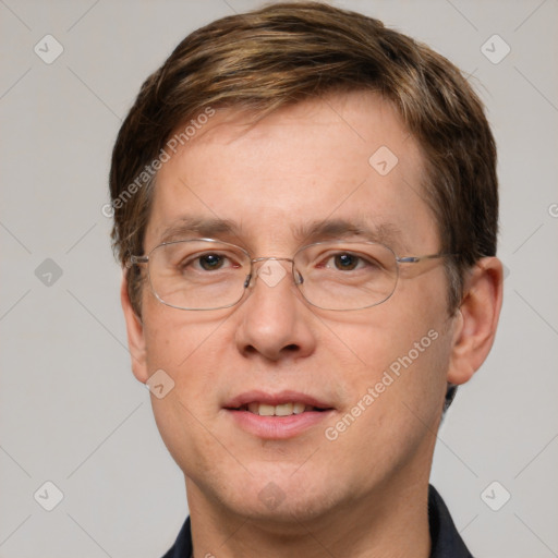 Joyful white adult male with short  brown hair and grey eyes