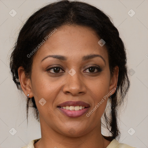 Joyful latino adult female with medium  brown hair and brown eyes