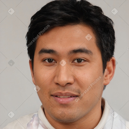 Joyful asian young-adult male with short  black hair and brown eyes