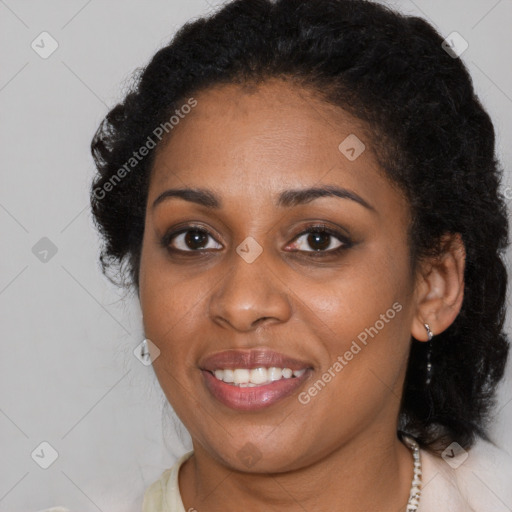 Joyful black young-adult female with long  brown hair and brown eyes