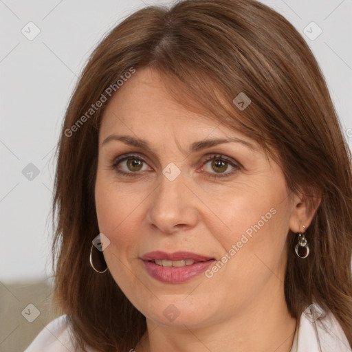 Joyful white adult female with medium  brown hair and brown eyes