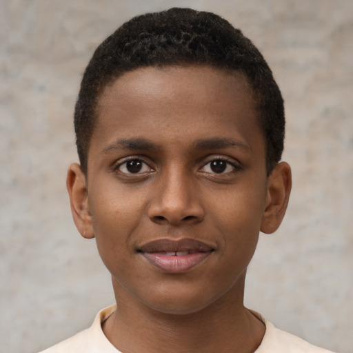 Joyful black young-adult male with short  brown hair and brown eyes