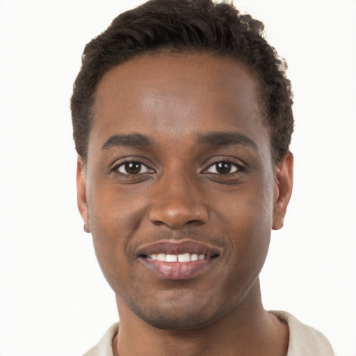 Joyful black young-adult male with short  brown hair and brown eyes