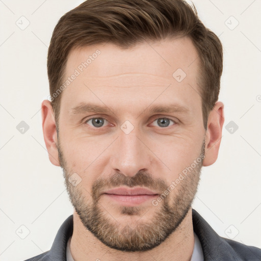 Joyful white young-adult male with short  brown hair and grey eyes