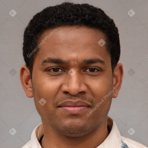 Joyful latino young-adult male with short  brown hair and brown eyes
