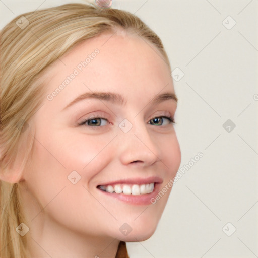 Joyful white young-adult female with long  brown hair and blue eyes