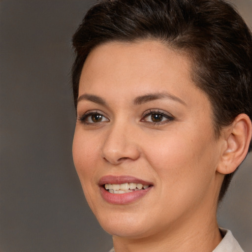 Joyful white young-adult female with short  brown hair and brown eyes