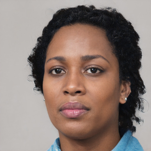 Neutral black young-adult female with medium  black hair and brown eyes