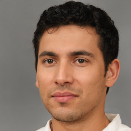 Neutral white young-adult male with short  black hair and brown eyes