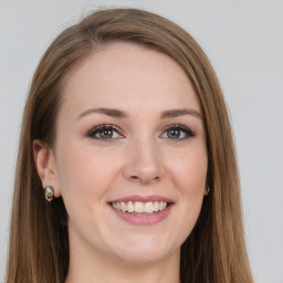 Joyful white young-adult female with long  brown hair and grey eyes