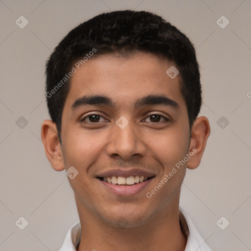 Joyful latino young-adult male with short  black hair and brown eyes