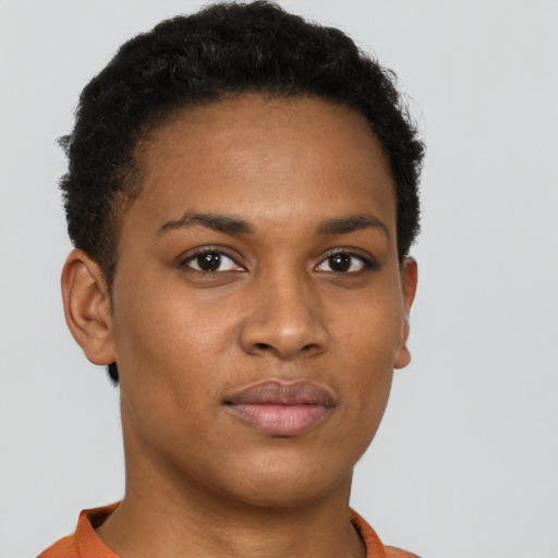 Joyful black young-adult female with short  brown hair and brown eyes