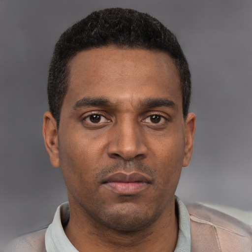Neutral latino young-adult male with short  brown hair and brown eyes