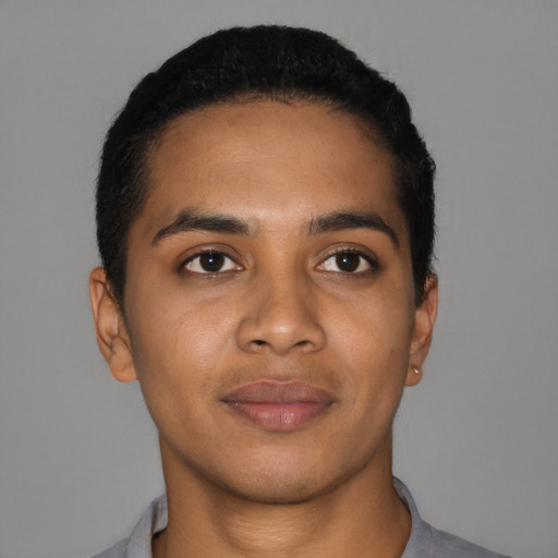 Joyful black young-adult male with short  black hair and brown eyes