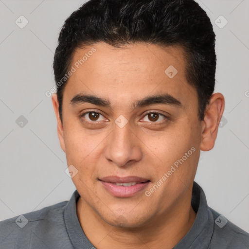 Joyful latino young-adult male with short  brown hair and brown eyes