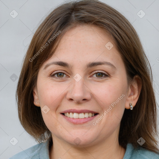 Joyful white adult female with medium  brown hair and grey eyes