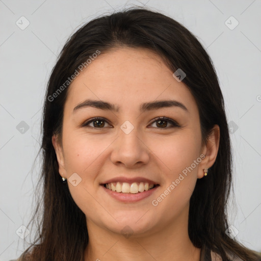 Joyful white young-adult female with long  brown hair and brown eyes