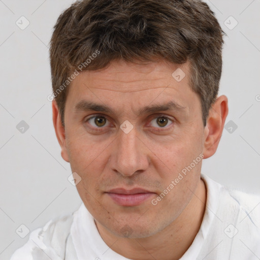 Joyful white adult male with short  brown hair and brown eyes