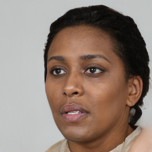 Neutral black young-adult female with medium  black hair and brown eyes