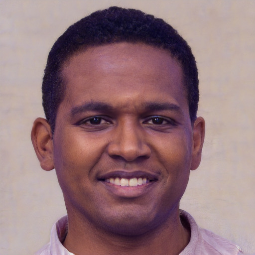 Joyful black young-adult male with short  brown hair and brown eyes