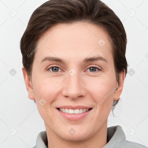 Joyful white young-adult female with short  brown hair and grey eyes