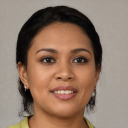 Joyful asian young-adult female with medium  brown hair and brown eyes