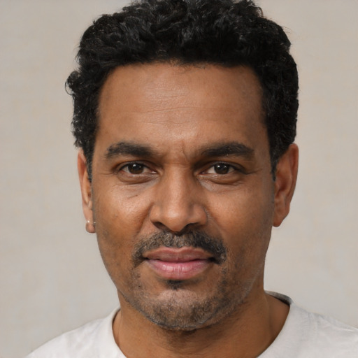 Neutral black adult male with short  black hair and brown eyes