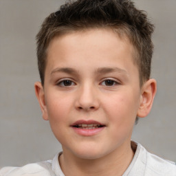 Joyful white child male with short  brown hair and brown eyes