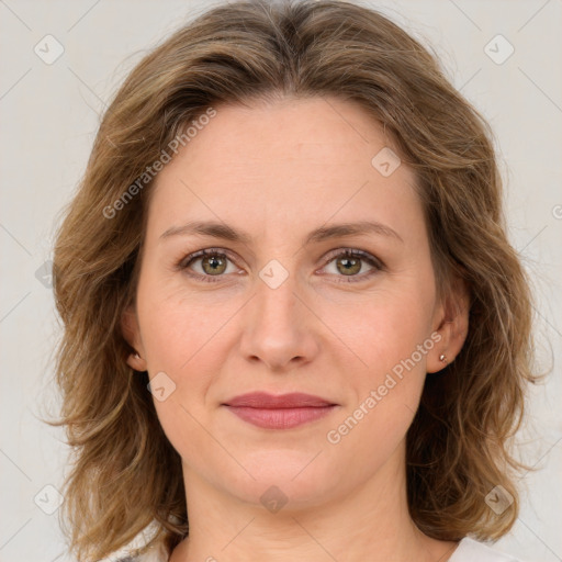 Joyful white young-adult female with medium  brown hair and green eyes