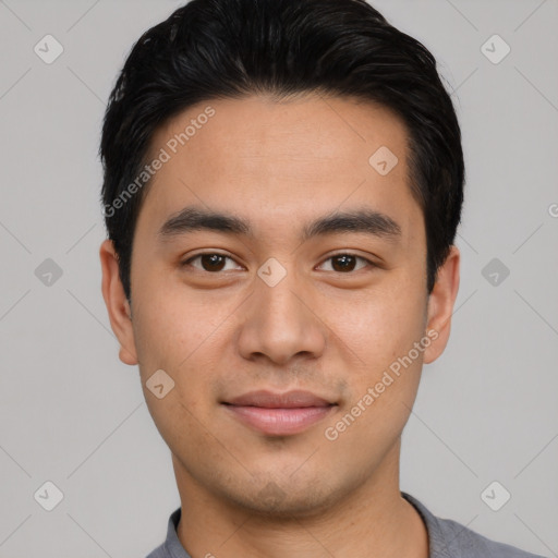 Joyful asian young-adult male with short  black hair and brown eyes