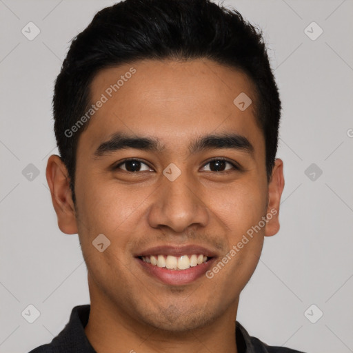 Joyful latino young-adult male with short  black hair and brown eyes