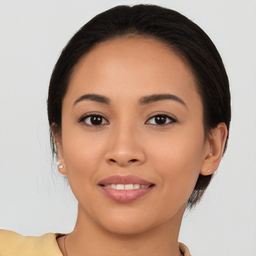 Joyful white young-adult female with long  brown hair and brown eyes