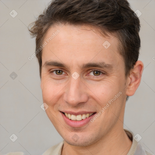 Joyful white adult male with short  brown hair and brown eyes