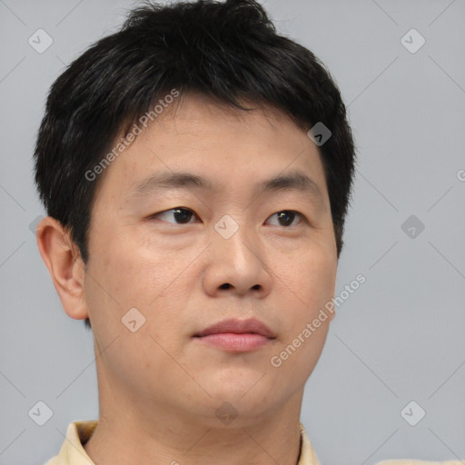 Neutral asian young-adult male with short  brown hair and brown eyes