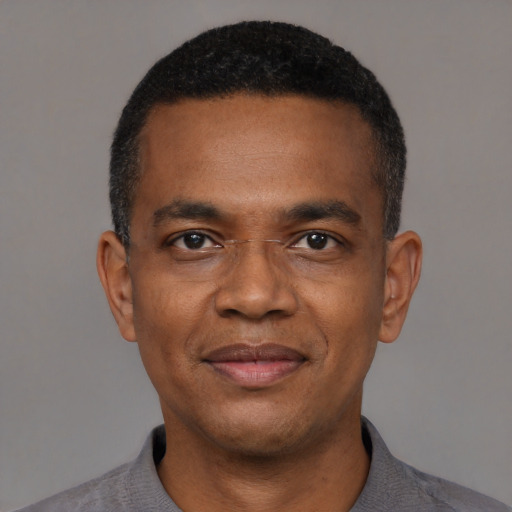 Neutral black adult male with short  black hair and brown eyes