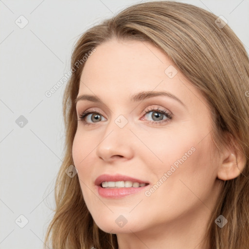 Joyful white young-adult female with long  brown hair and blue eyes