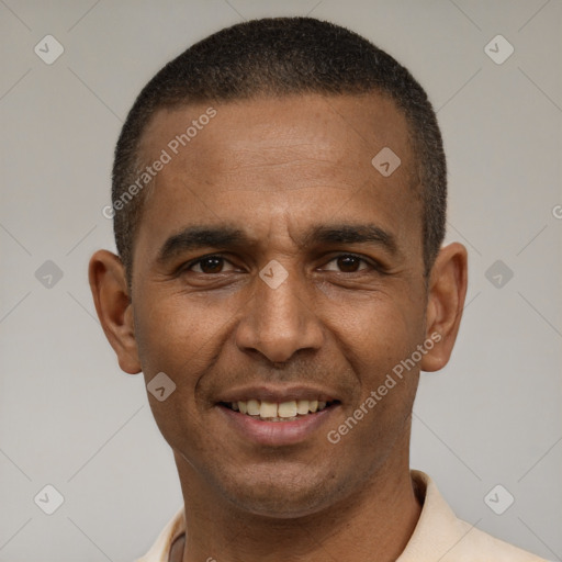 Joyful latino young-adult male with short  brown hair and brown eyes