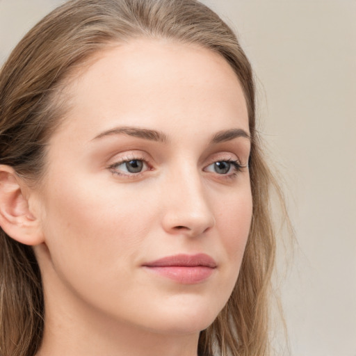 Neutral white young-adult female with long  brown hair and grey eyes