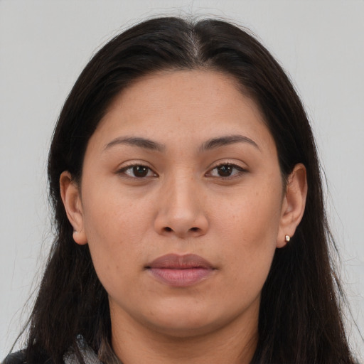 Neutral white young-adult female with long  brown hair and brown eyes