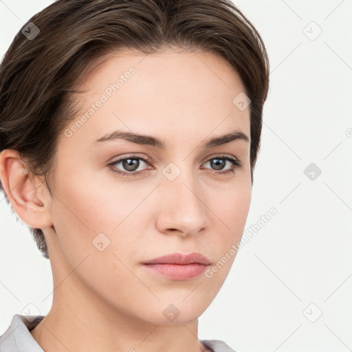 Neutral white young-adult female with short  brown hair and brown eyes