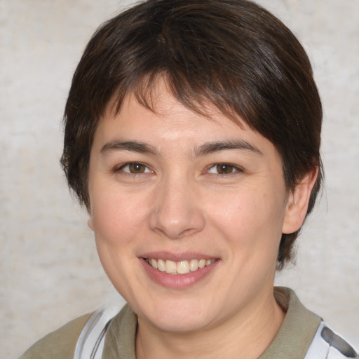 Joyful white young-adult female with medium  brown hair and brown eyes