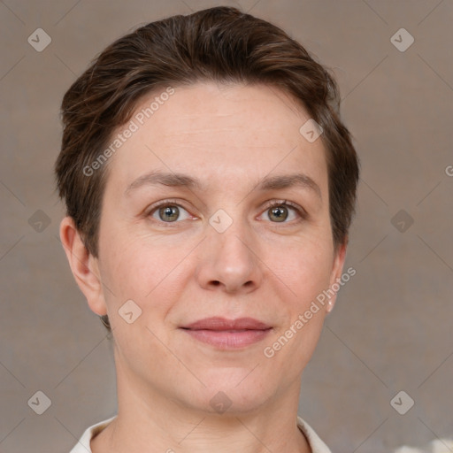 Joyful white adult female with short  brown hair and grey eyes