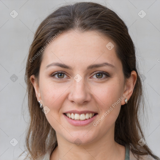 Joyful white young-adult female with medium  brown hair and grey eyes