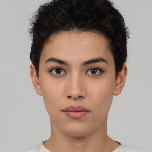 Neutral white young-adult female with short  black hair and brown eyes