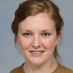 Joyful white young-adult female with medium  brown hair and blue eyes