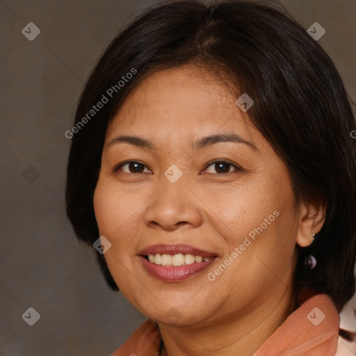 Joyful white adult female with medium  brown hair and brown eyes