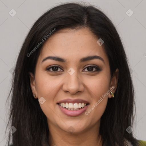 Joyful latino young-adult female with long  brown hair and brown eyes