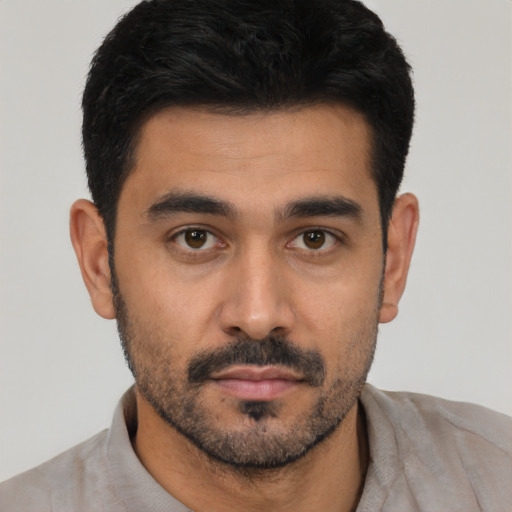 Neutral latino young-adult male with short  black hair and brown eyes