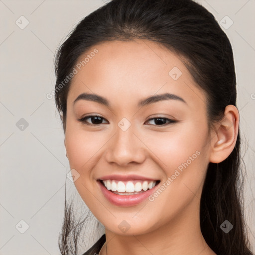 Joyful white young-adult female with long  brown hair and brown eyes