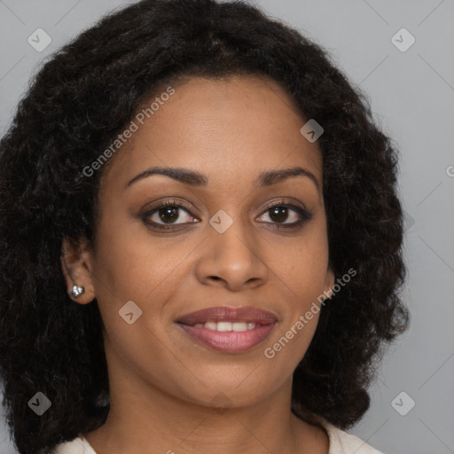 Joyful black young-adult female with long  brown hair and brown eyes